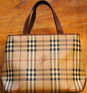 Purses, such as this one by Burberry, are fashion accessories with a function.